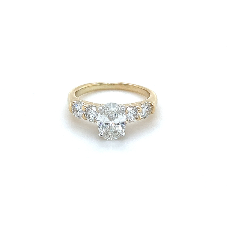 blank semi mount - setting all customers stones  Metal=14 Karat   Color=Yellow  Size=5.75  style # RM504/J  white 4 prong head for oval center  dimensions are 8.4 x 5.97 mm   customer side stones are round  3.79  3.61  3.83  3.74 mm
